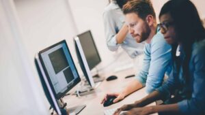 people looking at a computer screen