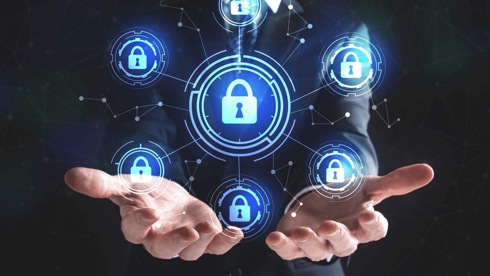 A man's hands which have lock icons floating above them